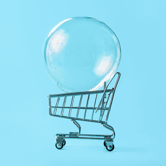 Dlaczego rosną ceny? - Shopping Cart With Soap Bubble On Blue